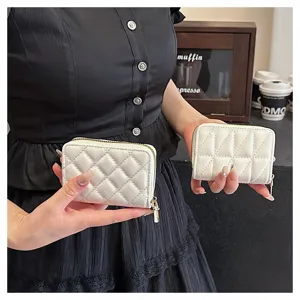 White quilted card holder for women, compact PU leather zipper wallet with multiple slots.