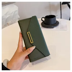 Dark green long wallet for women, minimalist envelope design with gold metal clasp and card slots.