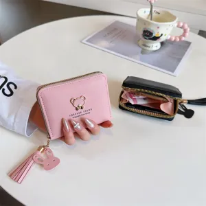 Pink and black short zip wallets for women with cute bear metal decor and tassel pendant.