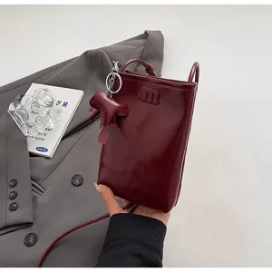 Cute mini elephant crossbody phone bag for women, stylish wine red PU leather small shoulder bag.