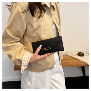 Women's long wallet envelope style black minimalist clutch purse with gold metal accent