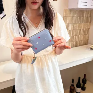 Cute blue PU leather short wallet for women with sweet embroidered hearts and lovely tassel.