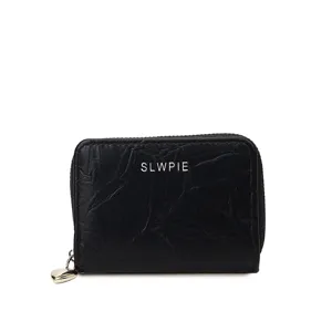 Black mini zipper card holder with heart charm, stylish small coin purse for women.