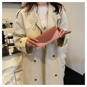 Women's long wallet chic two-tone color-block folding card holder clutch bag detail.