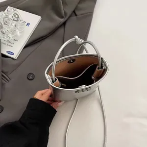 Silver mini phone bag for women, stylish metallic crossbody shoulder bag for daily casual walks.