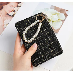 Black tweed cardholder with pearl strap, elegant mini wallet for women and coin purse style.
