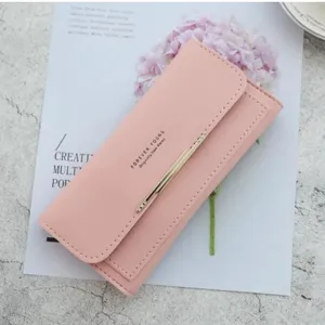 Pink long wallet for women, stylish minimalist design with metallic accent and card slots.