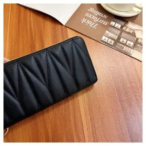 Black quilted long zip wallet for women, large capacity design with elegant texture details.