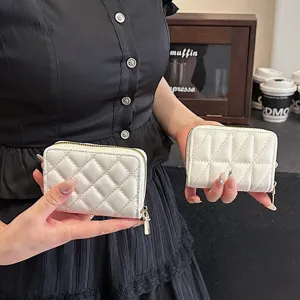 White quilted lambskin texture card holder wallet with zipper, compact multi-card organizer.