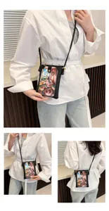 Women black crossbody phone bag detail view, cute printed mini shoulder bag for daily use.