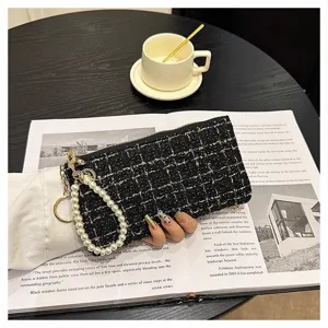 Women short tweed woven wallet clutch with pearl wrist strap and gold hardware detail.