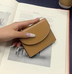 Minimalist solid color PU leather short wallet and card holder, compact and portable design.