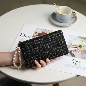 Black tweed clutch wallet for women with elegant pearl wrist strap and fashion zipper purse.