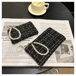 Black tweed short wallet with pearl wrist strap and gold keychain, chic clutch bag for women.