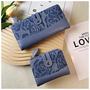 Detailed view of women denim rose pattern wallet featuring multi card slots and zipper closure.