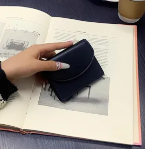 Compact dark blue PU leather short wallet card holder, minimalist style portable coin purse.