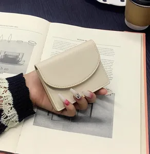 Detail view of the minimalist solid color PU leather short card wallet, compact and portable.