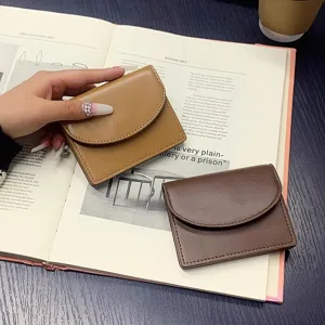 Minimalist solid color PU leather card holder and coin purse for daily use and travel.