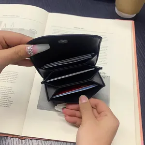 Black PU leather minimalist card holder mini wallet, portable slim coin purse for daily use.