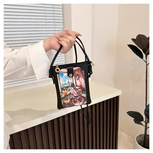 Detailed shot of a black PU leather crossbody phone bag featuring a cute anime illustration flap.