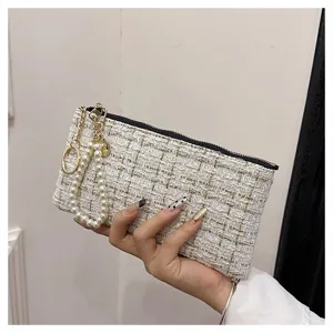 Chic tweed clutch wallet with pearl wrist strap, elegant short zipper pouch for women.