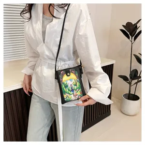 Detail view of the cute fashion crossbody phone bag with fairy tale forest print design.