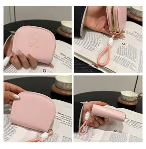 Cute pink accordion card holder for women with lanyard and bunny print, compact multi slot wallet.