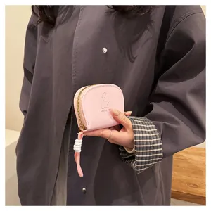 Cute pink accordion card holder with lanyard and cartoon print, compact and practical wallet.