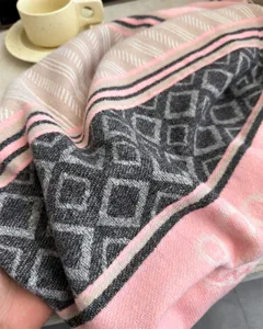 Cozy autumn winter cashmere feel patterned scarf detail, stylish geometric diamond print shawl.