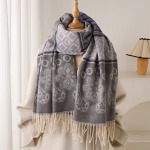 Detail shot of winter warm imitation cashmere scarf with elegant geometric and floral patterns.