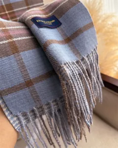 Cozy cashmere-feel plaid winter scarf with elegant tassels, warm and stylish for daily commute.