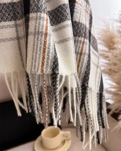 Cozy plaid cashmere-feel winter scarf with elegant fringe detail, warm and stylish daily.