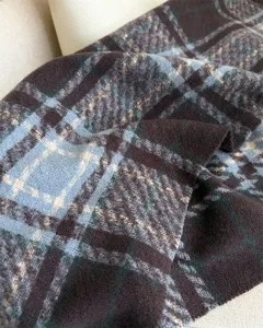 Soft plaid loop yarn cashmere-feel winter scarf detail view, warm and stylish unisex accessory.