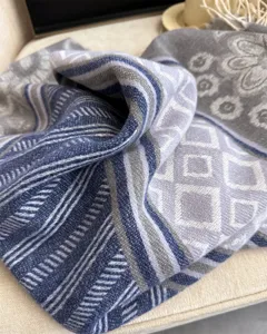 Detailed view of autumn winter geometric pattern cashmere feel warm scarf and shawl.