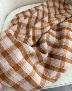 Cozy brown plaid imitation cashmere scarf detail showing soft textured fabric for winter.