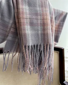Detail view of winter plaid fringe scarf, soft cashmere-feel shawl for women and men.
