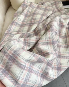 Cozy plaid cashmere-feel winter scarf with soft pink and grey tones for women and men.