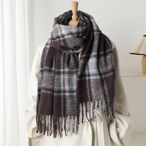 Detailed view of cozy plaid cashmere-feel tassel scarf for autumn and winter warmth.