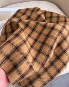 Cozy brown plaid cashmere-feel winter scarf for men and women, warm and stylish daily wear.