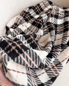 Detailed view of cozy faux cashmere plaid scarf, soft texture for winter daily wear.