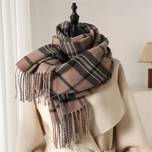 Close-up of cozy plaid tassel scarf detail, soft imitation cashmere texture, warm autumn style.