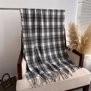 Detailed view of autumn winter classic black white plaid fringe scarf shawl warm stylish accessory