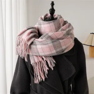 Cozy pink plaid tassel scarf detail, soft imitation cashmere winter warmth design accessory.