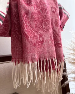 Red cashmere-feel tassel scarf detail, warm winter neck wrap, soft textured patterned shawl.