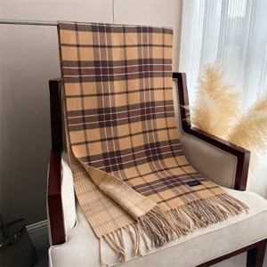 Classic plaid fringed cashmere feel winter scarf, elegant retro design detail view.