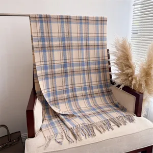 Cozy plaid cashmere-feel fringed scarf detail, ideal for autumn and winter wear.