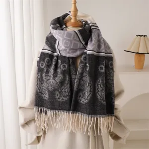 Winter imitation cashmere scarf with geometric pattern and tassels, cozy and warm fashion item.