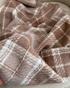 Cozy brown white plaid cashmere-feel loop yarn winter scarf detail shot, warm stylish unisex accessory.