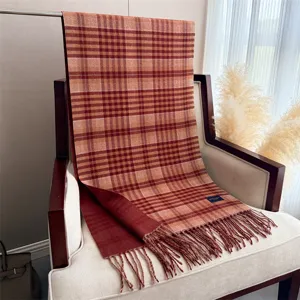 Detailed view of a classic plaid cashmere feel tassel winter scarf for stylish warmth.