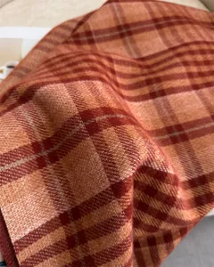 Detailed view of the autumn winter plaid imitation cashmere scarf fabric texture.